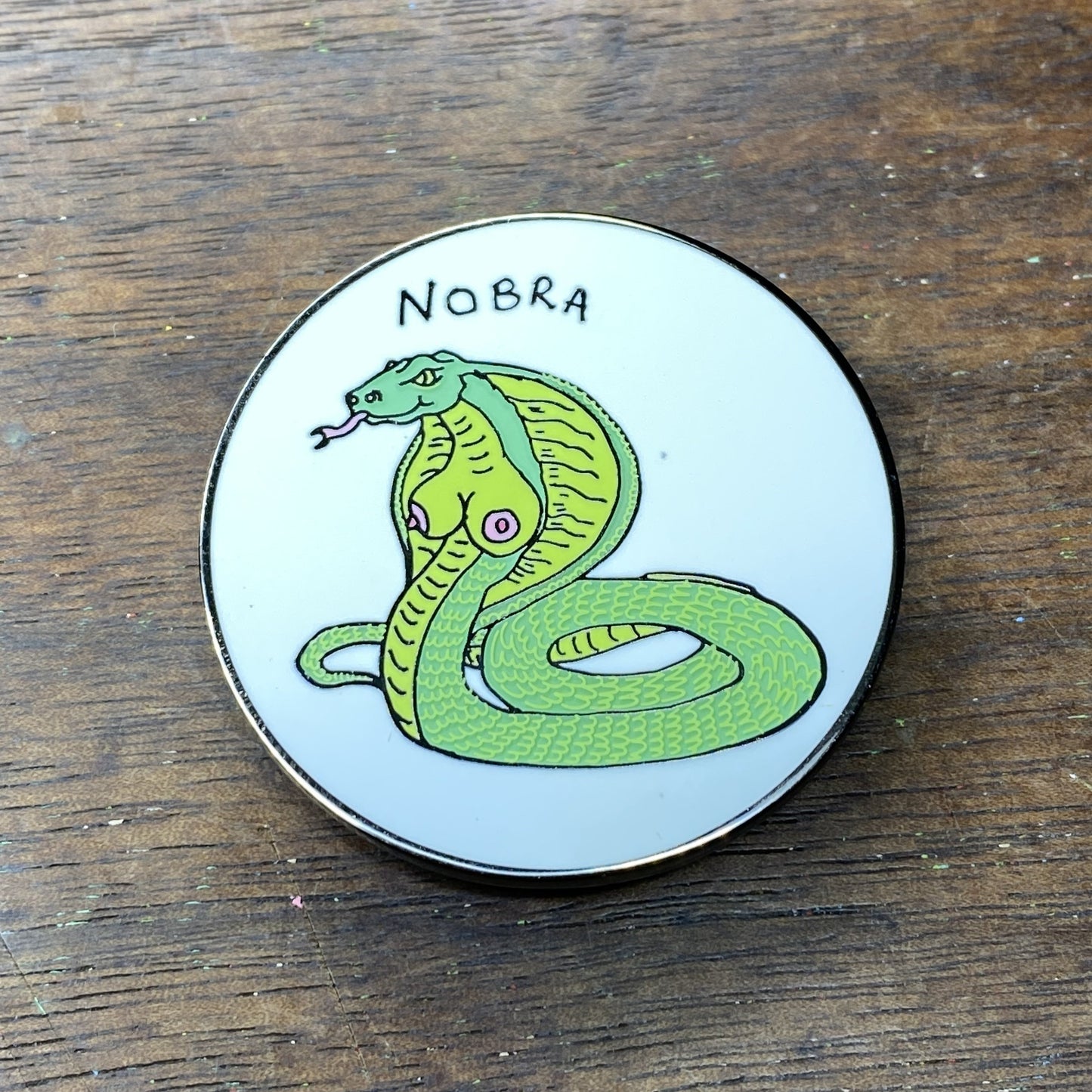 NOBRA ENAMEL PIN (GLOW IN THE DARK)